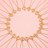 Collier floral breloque initiale | or