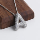 Collier bulle lettre initiale ensemble | or blanc