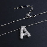 Collier bulle lettre initiale ensemble | or blanc