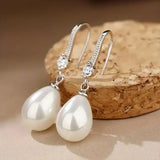 Boucles pendantes avec éclatant perles | or blanc